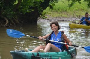 Laughing woman in kayak