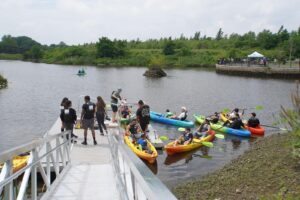 Upstream Alliance paddlers in kayaks