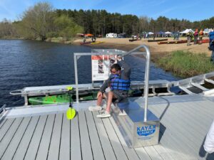 Adaptive paddler using BoardSafe kayak launch