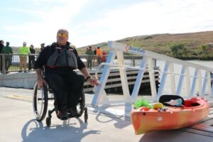 Bill Bogdan in wheelchair on BoardSafe adaptive kayak launch