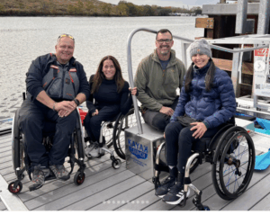 Patrons in wheelchairs sitting on BoardSafe adaptive kayak launch