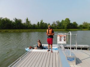Manlius NY man on dock, woman in kayak