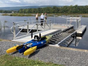 kayak and fisherman on launch dock