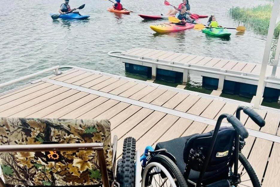 adaptive kayakers dock wheelchairs