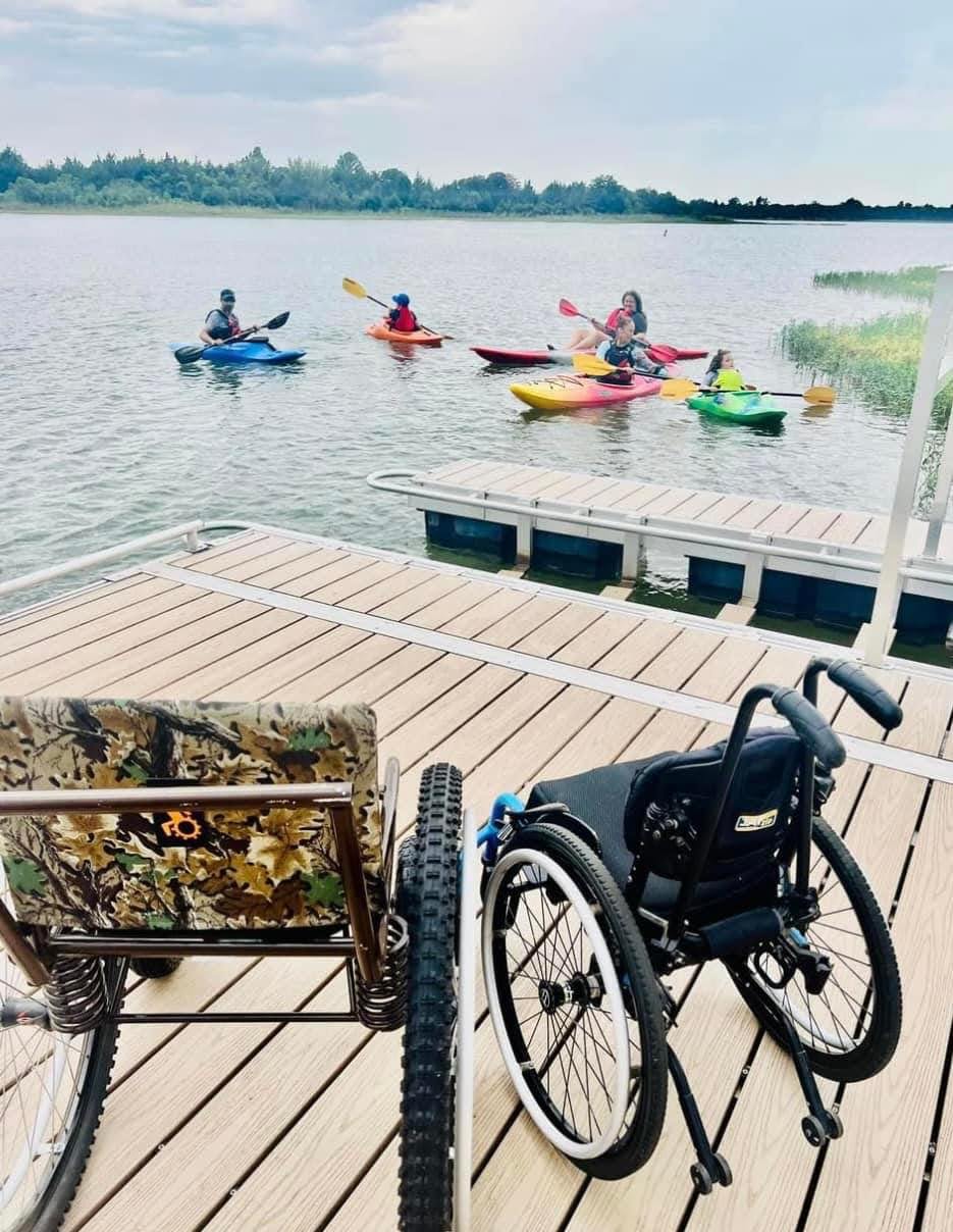 adaptive kayakers dock wheelchairs