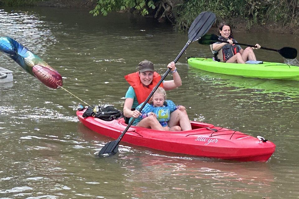 Beaver Creek woman and child in red kayak