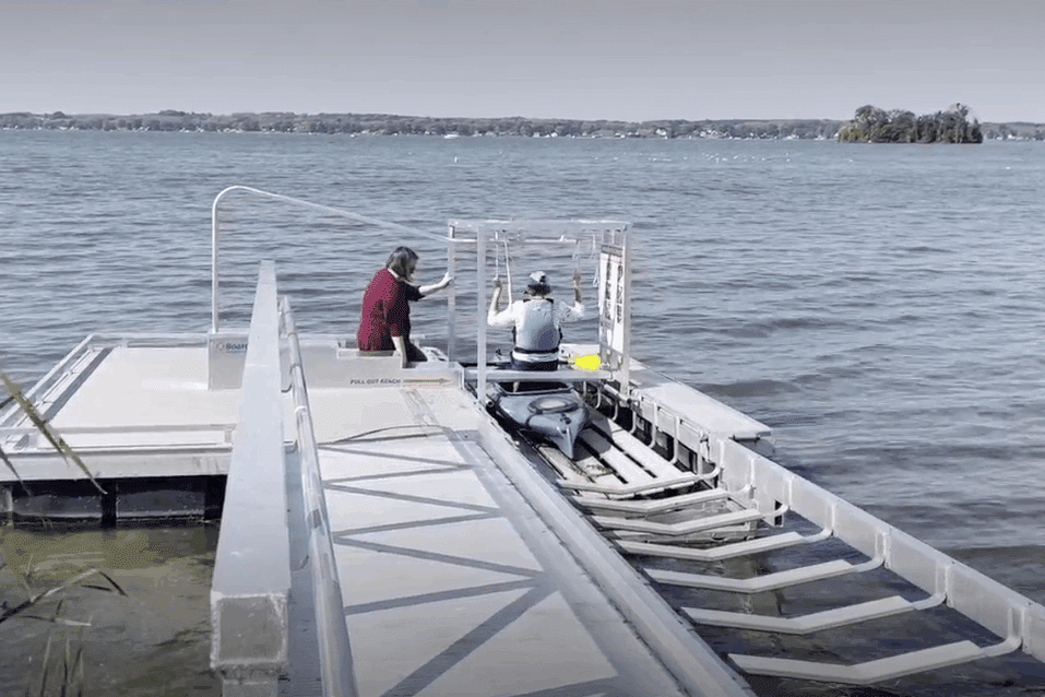 Boardsafe Lake Cayuga man entering kayak