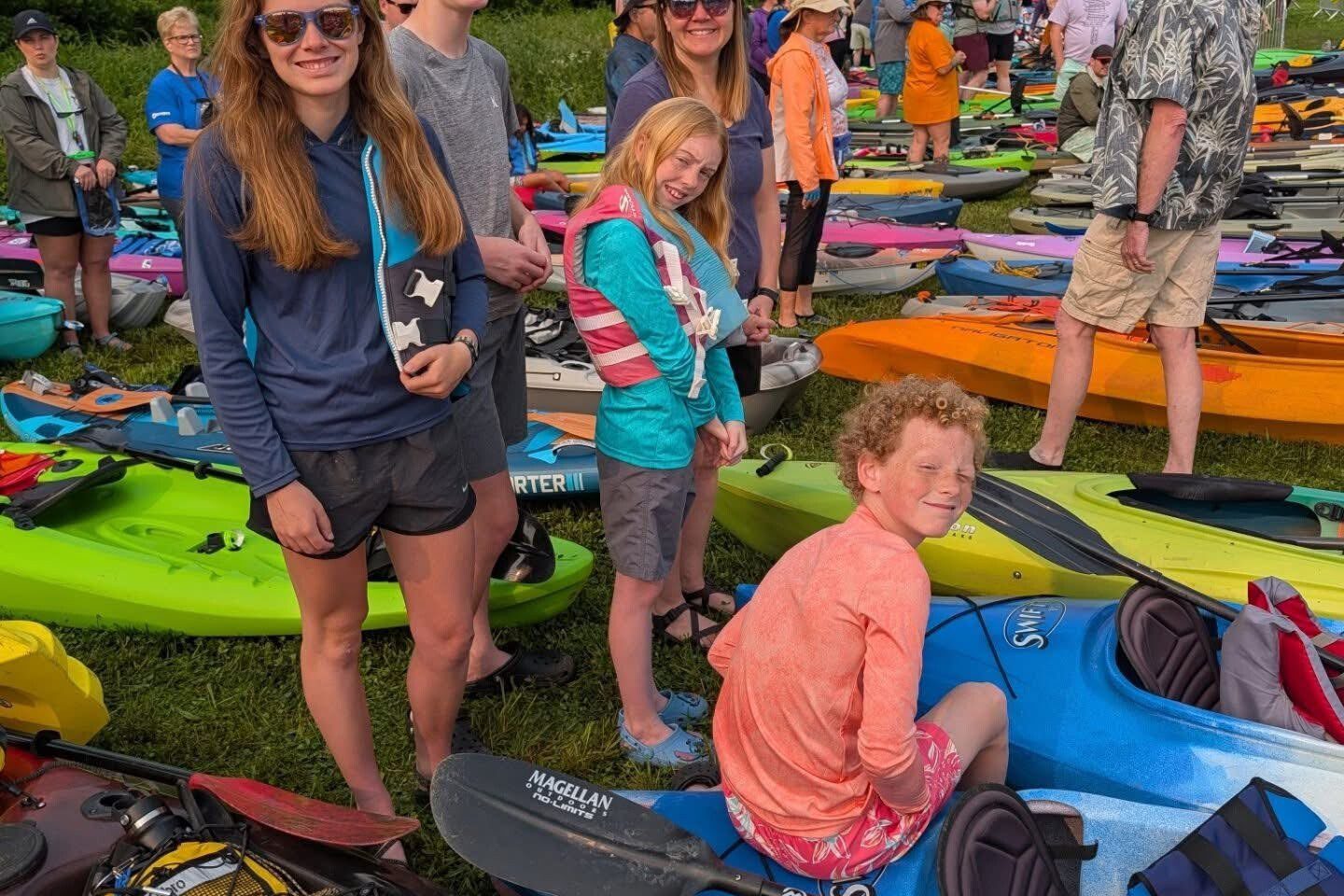Paddlers sitting and standing on paddleboats