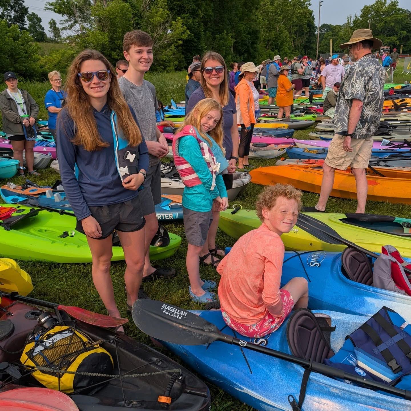 Paddlers sitting and standing on paddleboats