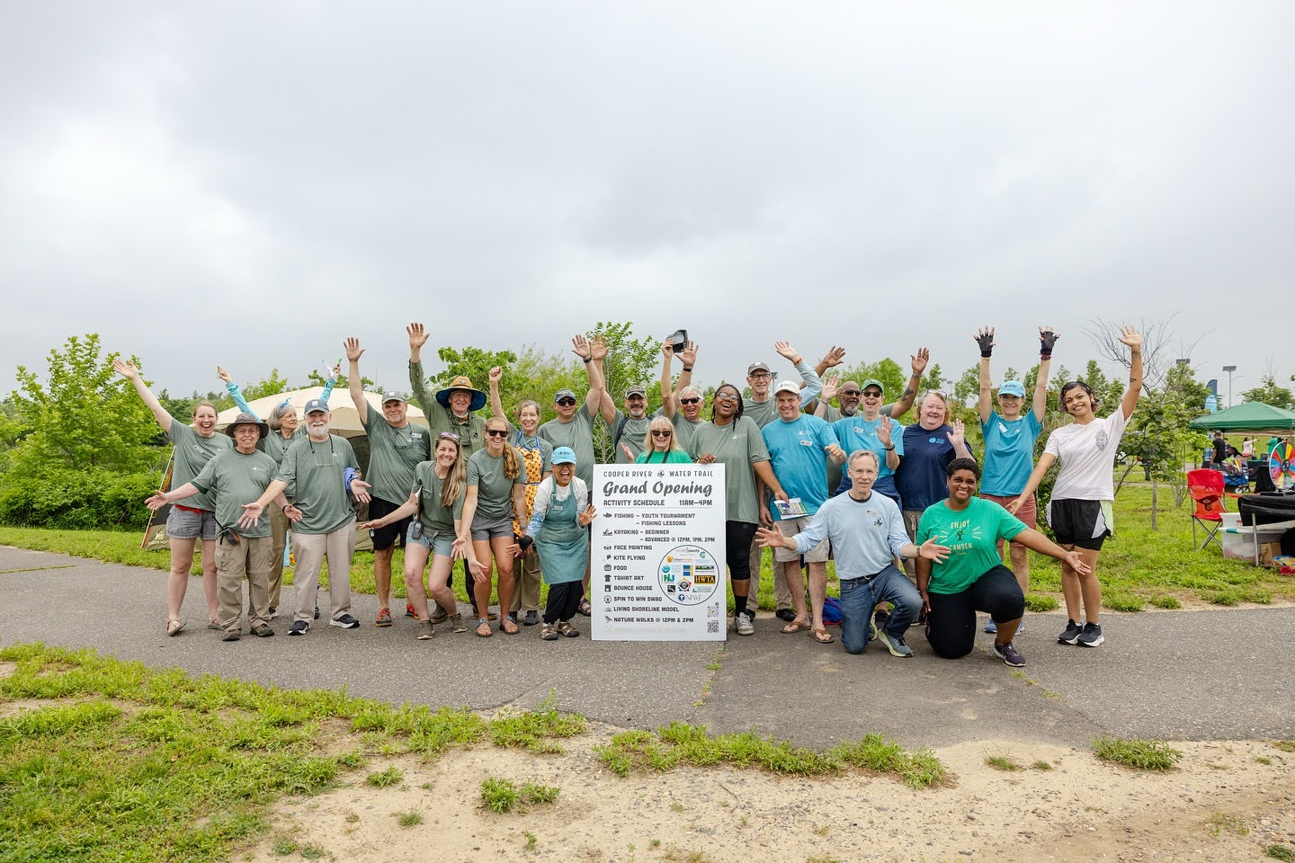 Upstream Alliance workers with grand opening sign